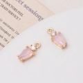 Close-up of elegant pink teardrop zircon charms with gold metal frames for DIY jewelry - Jelly Pink