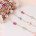 Gold plated link chain with colorful acrylic butterflies on a white spool for DIY jewelry - Gold Plated Multicolor Butterfly
