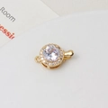 Macro shot of gold-plated round clasp with large white zircon and paved crystals - White Round (10x15mm)