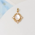 Detailed macro view of 18K gold-plated vintage pendant with white shell and zircons - 44#18*23mm