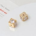 Detailed macro view of 18k gold plated hollow cube beads with micro-pave cubic zirconia - 10mm / Gold/White
