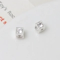 Detailed close-up of cubic silver spacer beads with inlaid clear zircons for jewelry making - 5mm / Silver/White