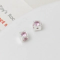Macro shot of silver cube spacers with pink zircon insets for DIY jewelry making - 5mm / Silver/Pink