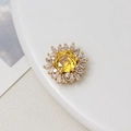 Gold-plated sunflower charm featuring a yellow round zircon and white baguettes stones - 15*17mm / Gold Yellow