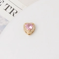 Macro shot of heart-shaped charm with pink zircon and white stones for DIY bracelets - 10mm / Gold Plated Pink
