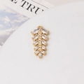 Detailed macro view of a gold-plated leaf charm with sparkling cubic zirconia inlay for DIY - 02# Wheat Style (14x27mm)