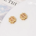 Detailed view of gold-plated clover beads with micro-pave zircons and pink heart stones - Clover Spacer Bead / 12mm / Gold-Pink