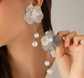 Elegant silver wire floral earrings with hanging white pearls on a model - Hollow Petal Artificial Pearl Drop Style / Silver Earrings