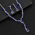 Detail of silver pearl necklace and blue crystal earrings on black background - Silver Royal Blue Two-piece Set