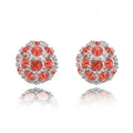 Detail view of sparkling red crystal studded spherical stud earrings in silver tone - Red