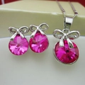 Elegant silver bow jewelry set with hot pink crystal pendant necklace and stud earrings - Deep Rose Red