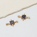 Gouden achthoekige ster hanger met donkerblauwe zirkoon en dubbele lussen - Blauw