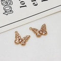 Detailed macro view of hollow gold butterfly pendants with inlaid rectangular zircons - Butterfly Style 03 (15*18mm)