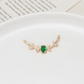 Macro shot of gold willow branch charm with green zircon and side connector loops - Branch Leaf Green Stone (04#14x31mm)