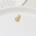 Elegant gold micro-paved zircon waterdrop tassel pendant on a white ceramic tray - Hollow Water Drop Style (08#)