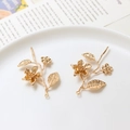 Macro detail of gold flower and leaf branch metal pendants for jewelry making - Style 01-25x45