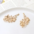 Close-up of golden bronze flower branch pendant with detailed texture and hanging holes - Style 02-29x45