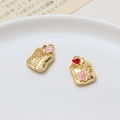 Close-up of golden omamori charms with pink enamel hearts and cherry blossom patterns - Peach Blossom Heart Style (04#)