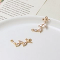 Macro shot of bird-shaped jewelry connector with marquise cubic zirconia on a gold branch - Bird on Branch Style (03#10*25mm)
