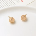 Detailed view of hollow gold-plated metal spherical pendants with pink crystal beads - 9*13mm / Light Pink