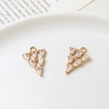 Detailed close-up of two golden pear-cut zircon teardrop pendants for DIY jewelry making - Teardrop Zirconia Geometric Mix (04#14*20mm)