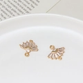 Macro view of gold-plated fan charm with white zircon inlay and dual link loops - Radial Fan Style (02)