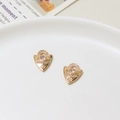 Macro shot of gold shield-shaped charms with pave cubic zirconia and evil eye teardrop stone - Evil Eye Style (04#10*19mm)