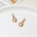 Close-up of gold geometric hollow pendants with zircon inlay for DIY jewelry making - Geometric Trapezoid Style (05#11*14mm)