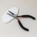 Macro detail of black and red needle nose pliers with spring for DIY jewelry making - Needle Nose Pliers (No Teeth)