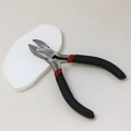 Detail view of diagonal cutting pliers with non-slip black and red handles for DIY crafts - Diagonal Cutting Pliers