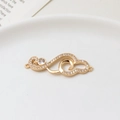 Macro shot of gold-plated wave pendant with micro-set zircons and dual-loop connectors - Wholesale Price For 2 (04# 12x34mm) / 04# 12x34mm