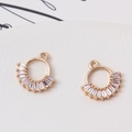 Macro detail of gold flower ring pendant with baguette zircon for DIY jewelry making - 14*14mm