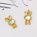 Detail of rabbit jewelry pendants with matte gold finish and iridescent opal inlays - 9*16mm / Iridescent Rabbit Head Style (LF2836)