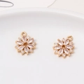 Macro detail of gold plated cubic zirconia snowflake charms for DIY jewelry making - Style 03 (13*15mm)