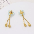 Detail view of gold butterfly tassel earrings with blue wings and small bells - Light Blue