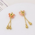 Detail of butterfly pendants with translucent wings, gold tassels and small bells - Orange
