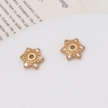 Macro shot of gold star-shaped jewelry spacers with cubic zirconia and center holes - 02# (10mm)