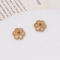 Macro shot of gold-plated flower spacers with micro-set zircons for jewelry making - 03# (10mm)