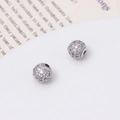 Macro shot of micro-pave cubic zirconia silver charms for DIY jewelry making - 6mm