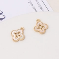 Detailed close-up of golden clover charms featuring white shell inlay and zircon accents - Four-leaf Clover With Zircon Style (01#13*15mm)