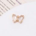 Close-up of a zircon-studded crystal butterfly pendant for DIY jewelry making - White