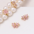 Macro shot of gold floral butterfly charms with pink zircons on pearl bracelet - Pink Flower Butterfly (04#Pink-Flower Butterfly)