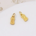 Detailed view of gold-plated lucky charms featuring engraved Chinese calligraphy symbols - Prosperity & Good Fortune Style (No. 02, 6x11mm)