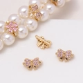 Macro shot of gold-plated butterfly zircon spacer charms on a DIY pearl necklace - Light Purple Bowknot (12#Light Purple-Bowknot)