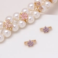 Macro detail of gold flower and butterfly spacers with zircon inlays for pearl jewelry - Violet Blossom Style (15#Violet-Blossom)