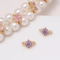 Macro view of colorful zircon flower and butterfly charms on a pearl necklace - Violet Sun Style (17#Violet-Sun)