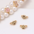 Detailed view of gold flower and butterfly spacer beads with micro-set zircon for DIY jewelry - Olive Green Cat Paw (20#Olive Green-Cat Paw)
