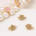 Detailed macro view of gold-plated flower spacers with green micro-pave cubic zirconia - Olive Green Five Petal Flower (22#Olive Green-Petal)