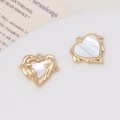 Macro shot of gold-plated heart pendant with natural white shell inlay and metal details - #13 Angel Heart Pendant (18*17mm)