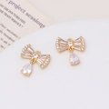 Macro view of 18K gold-plated bow pendants featuring micro-pave zircons for DIY jewelry - Bow Teardrop Style (02#)
